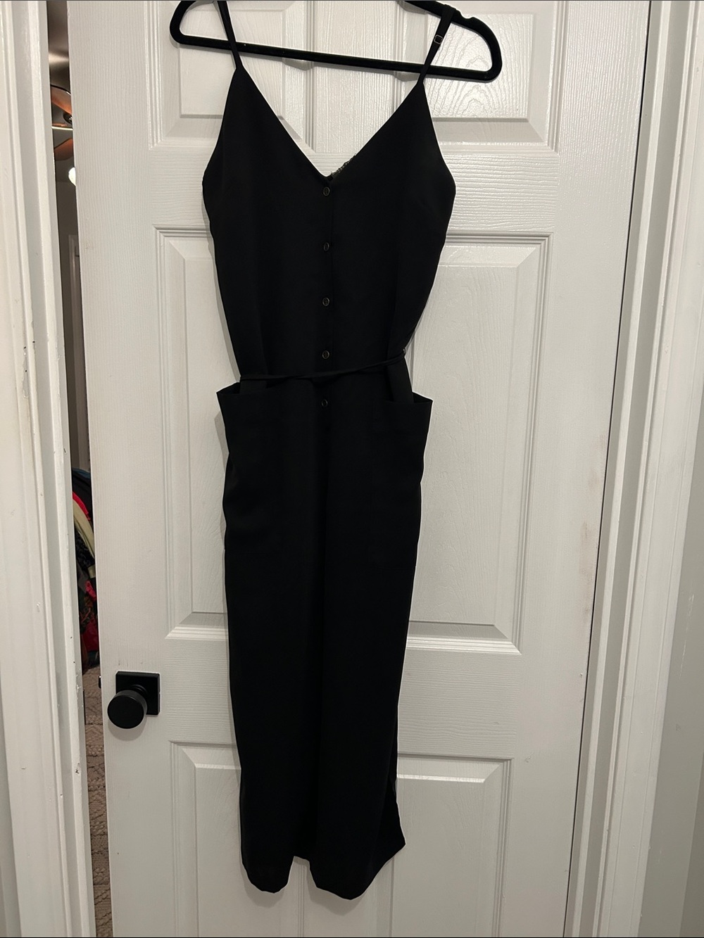 Dress Forum Black Sleeveless Button-Front Jumpsuit with Pockets 🤍